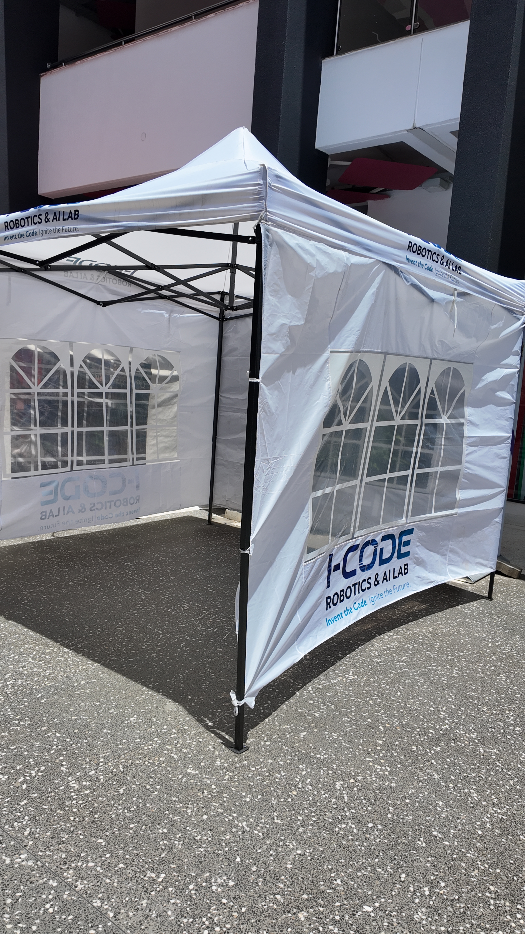 i-CODE branded gazebo set up for outdoor activation