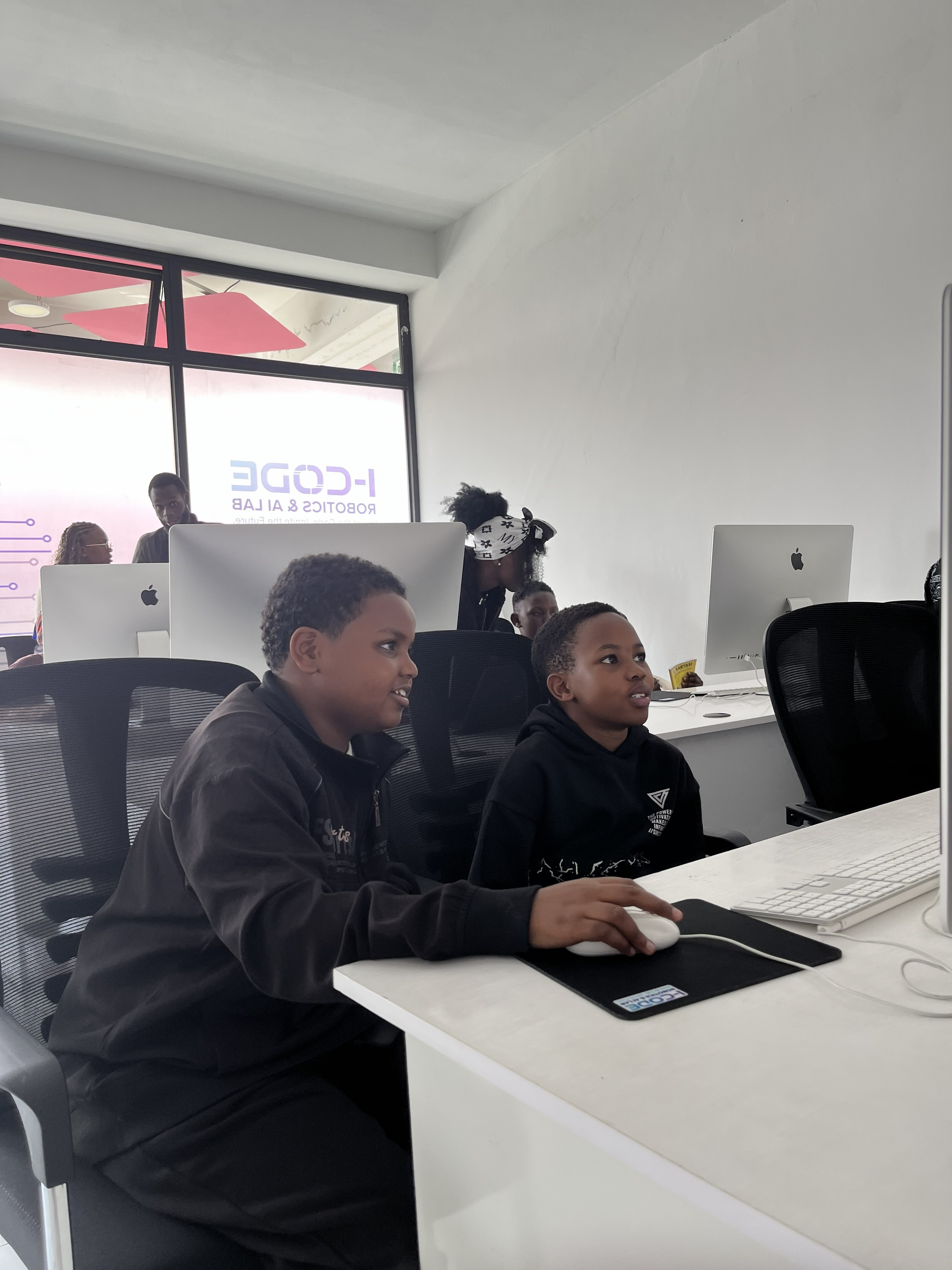 Builders group engaged at iMac — July Bootcamp 2026