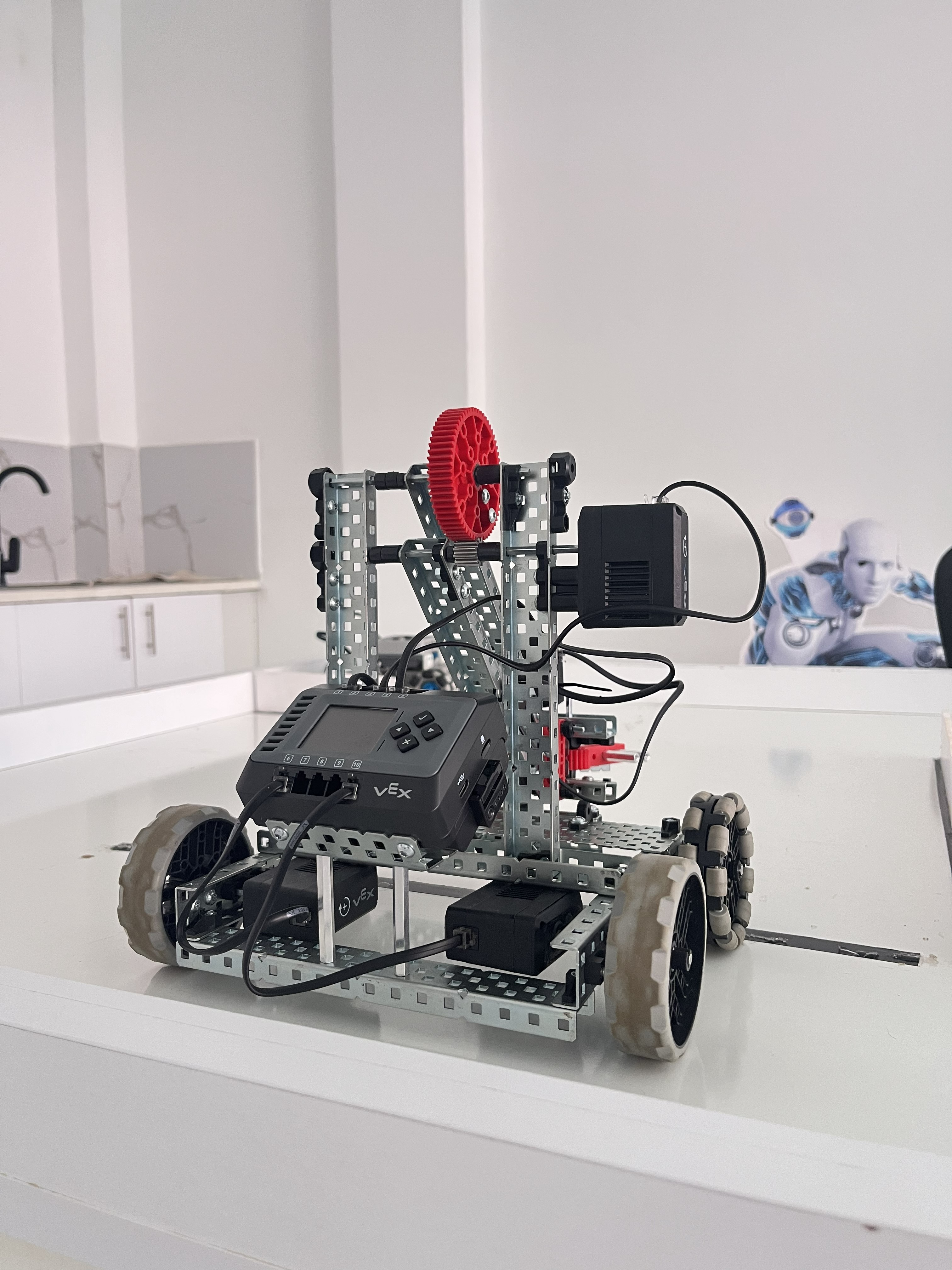 VEX EXP robot with gear arm ready in i-CODE lab