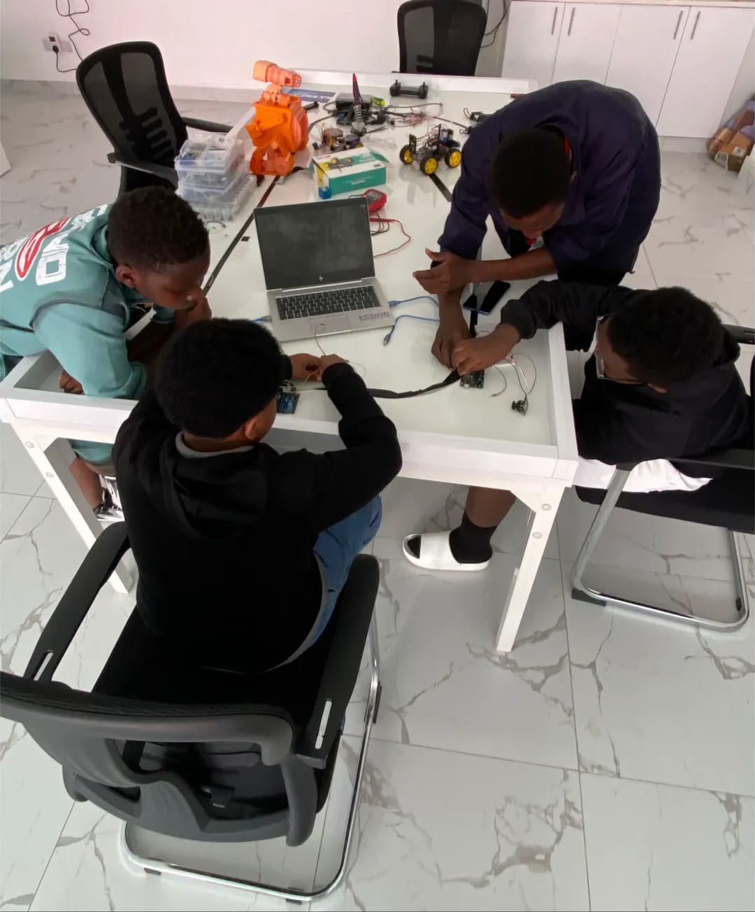Young innovators build Arduino robot together
